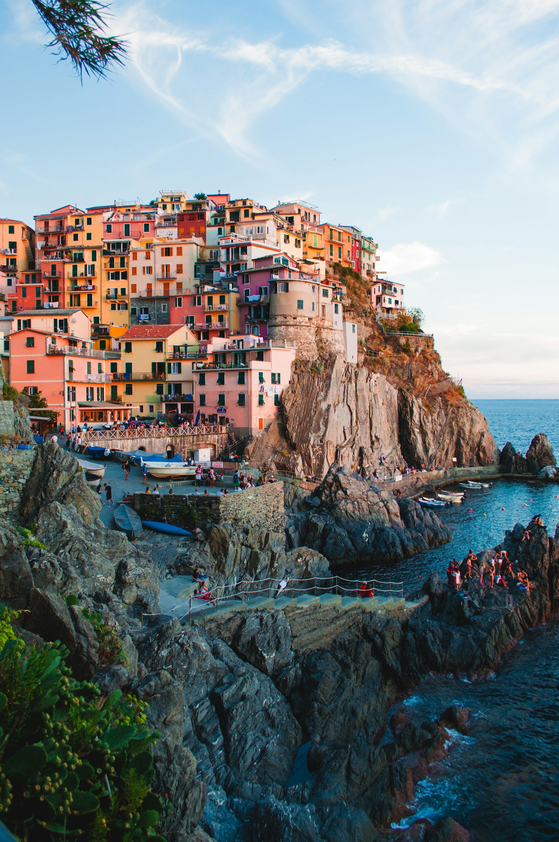 Colorful houses above the rocky coastline of Manarola in Italy’s Cinque Terre